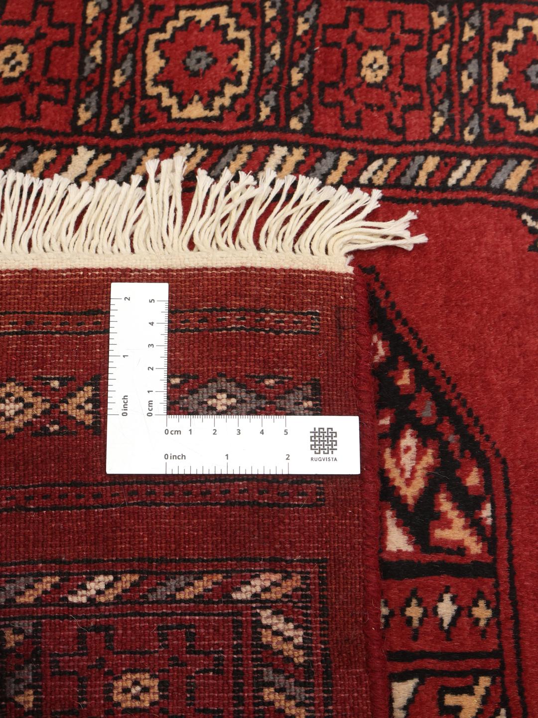 Handmade runner rug from Pakistan in red