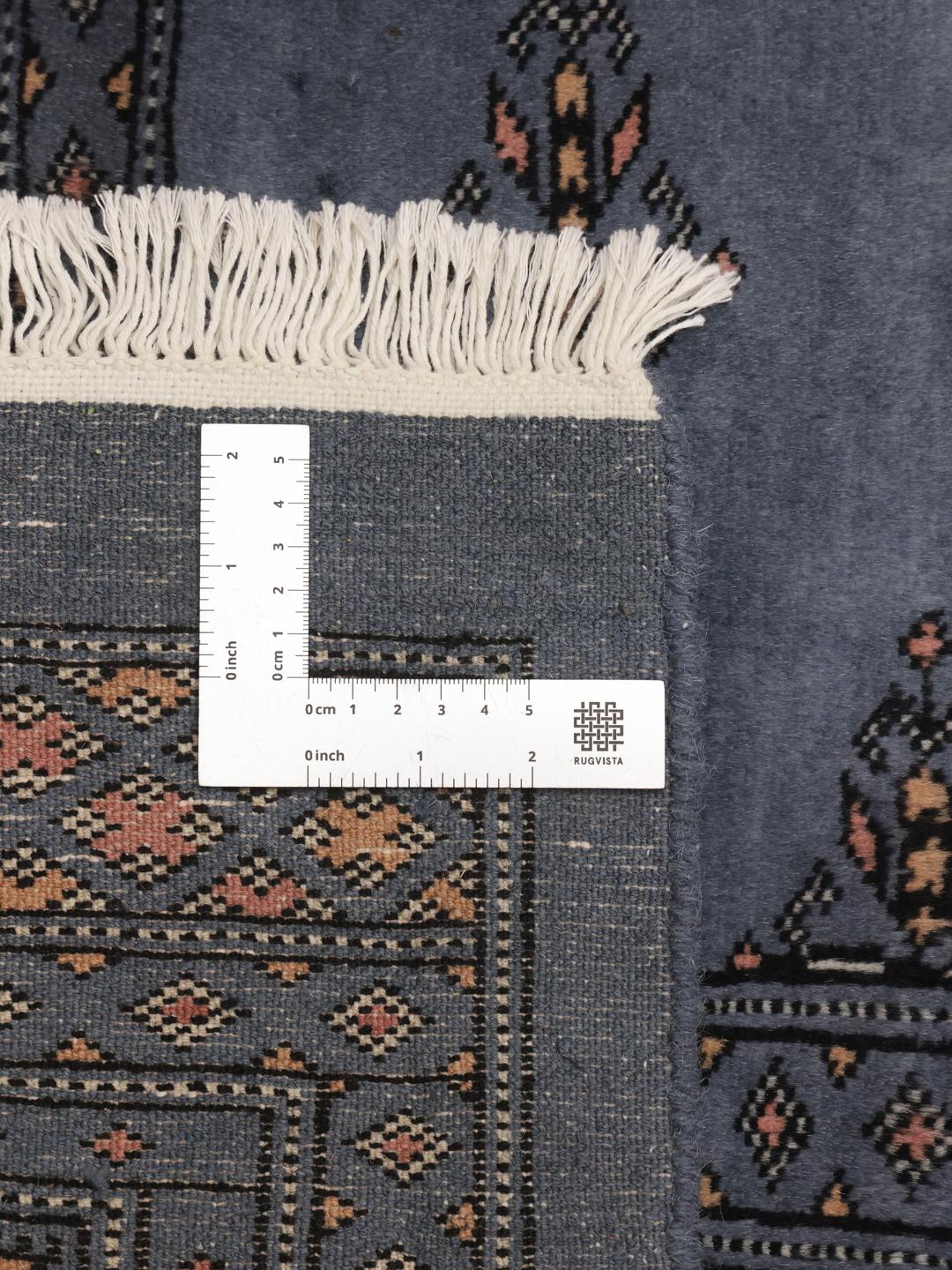 Handmade Pakistan wool rug in blue with traditional patterns