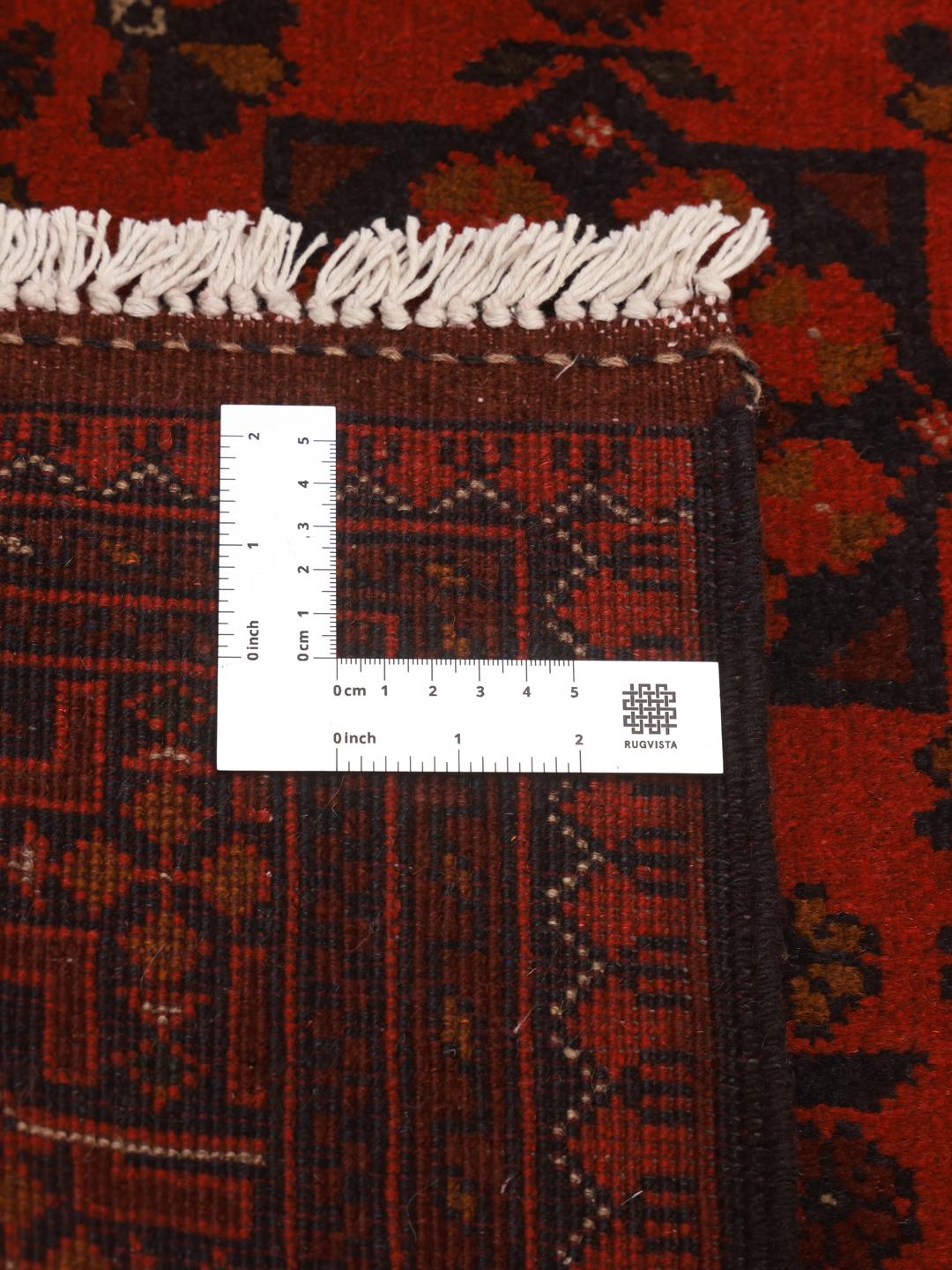 Vloerkleed uit Afghanistan in het rood