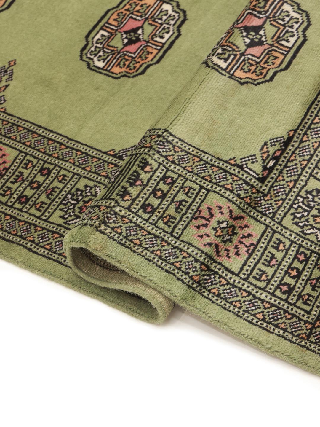 Runner rug from Pakistan in light-green with traditional patterns