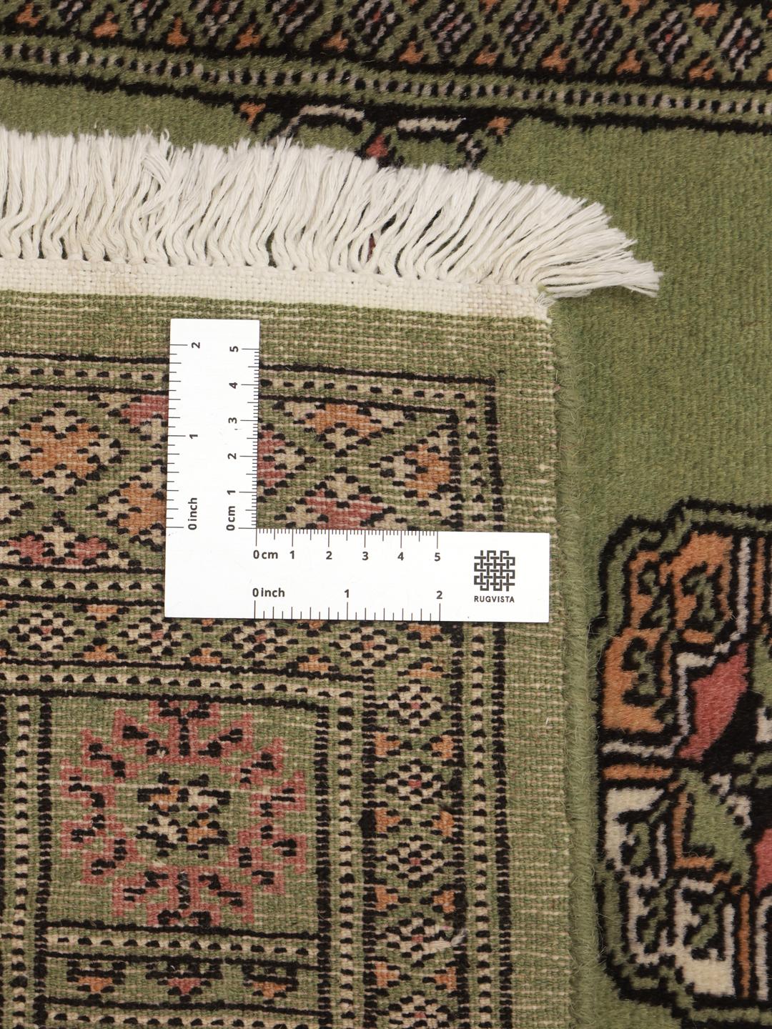 Runner rug from Pakistan in light-green with traditional patterns