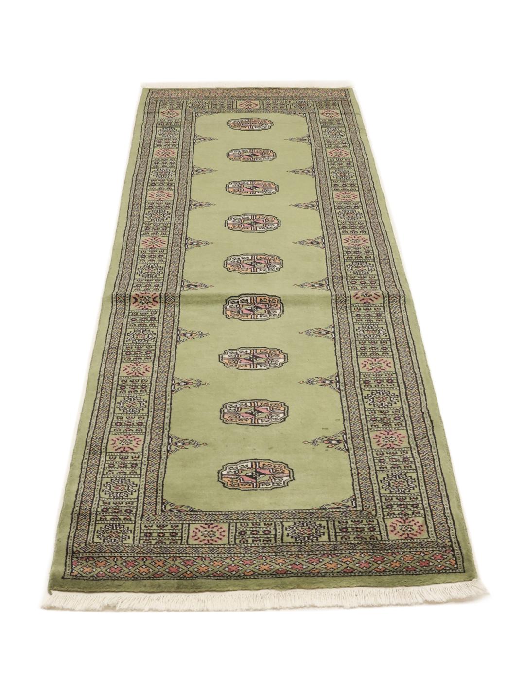 Runner rug from Pakistan in light-green with traditional patterns