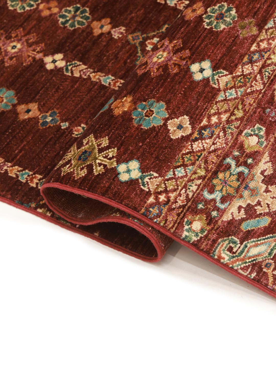 rug from Afghanistan in dark-red