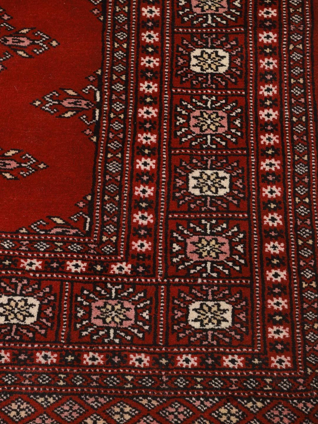 Handgemaakt wollen vloerkleed uit Pakistan in rood