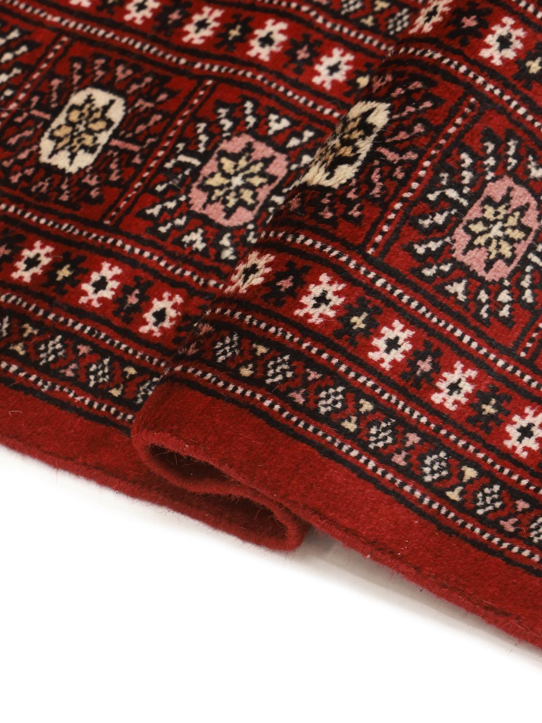 Handgemaakt wollen vloerkleed uit Pakistan in rood