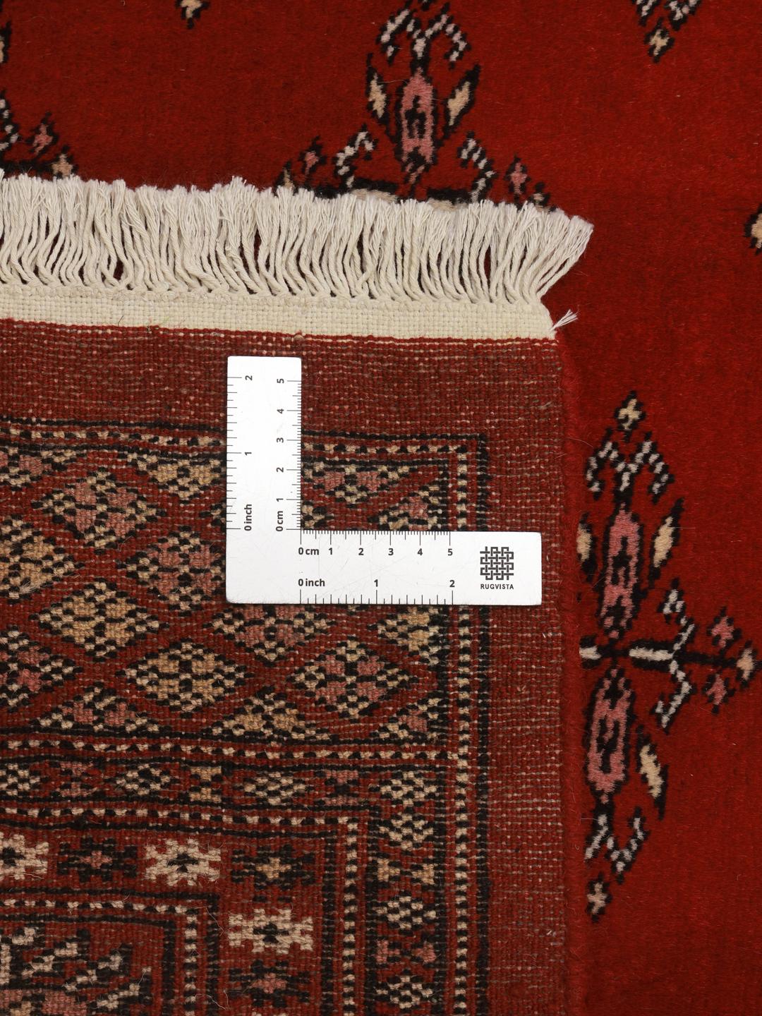 Handgemaakt wollen vloerkleed uit Pakistan in rood