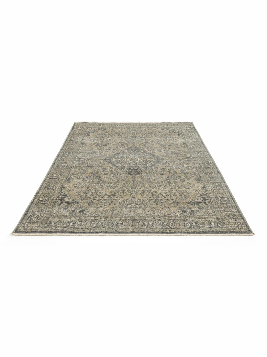 Groen vloerkleed met een klassiek bloemenmedaillonpatroon en franjes
