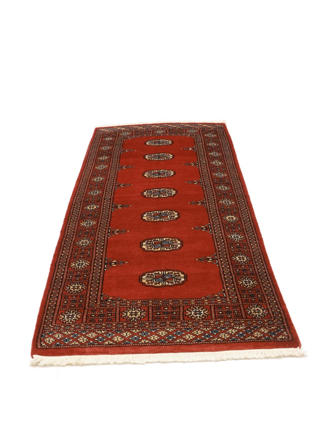 Red runner rug from Pakistan