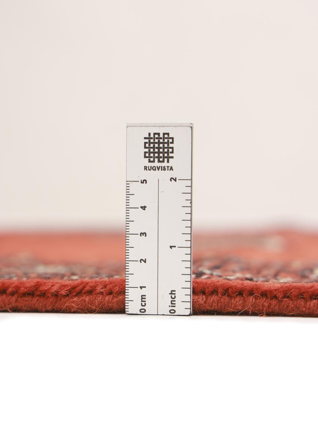 Red runner rug from Pakistan