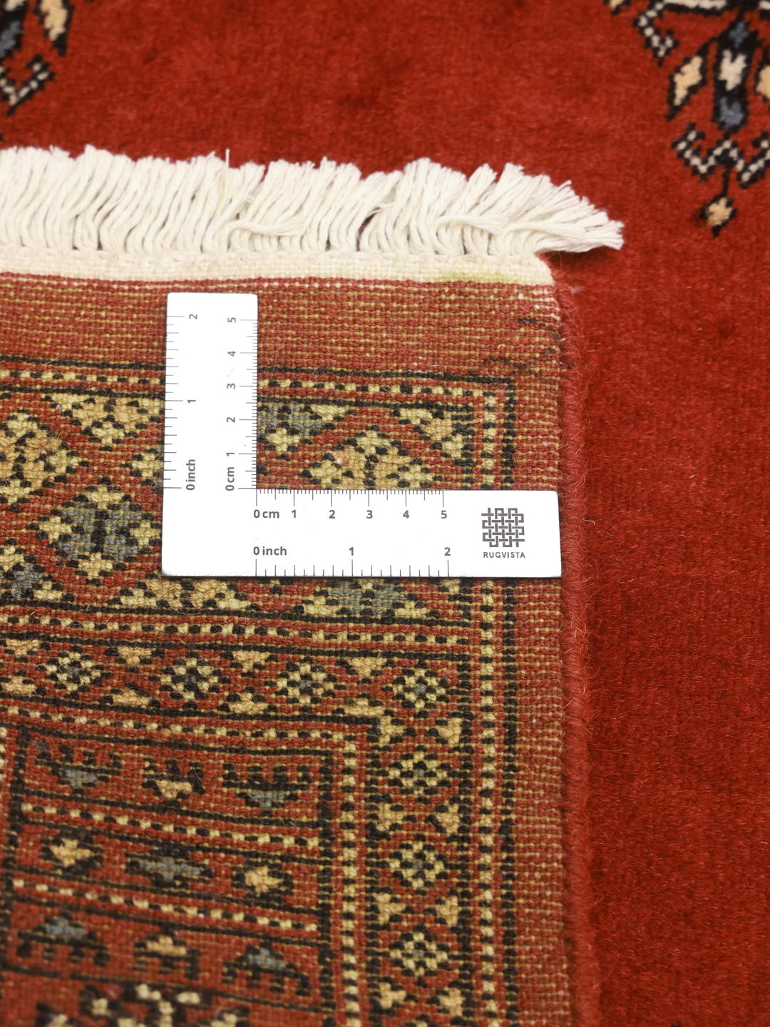 Red runner rug from Pakistan