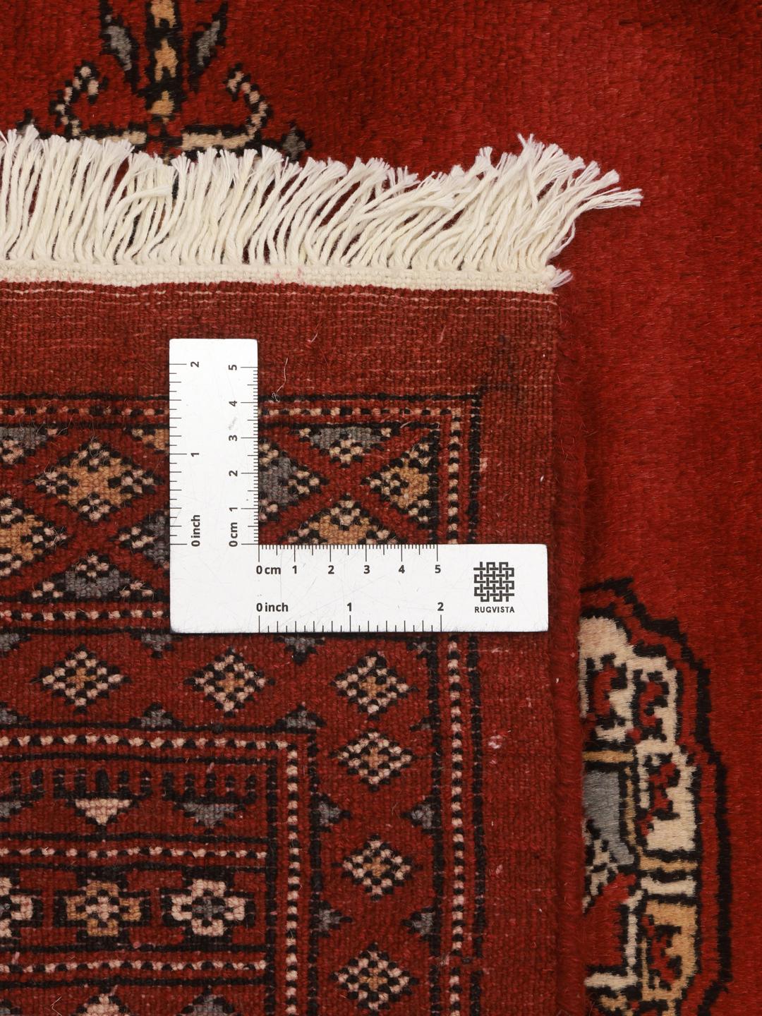 Handgeknoopt vloerkleed uit Pakistan in het rood