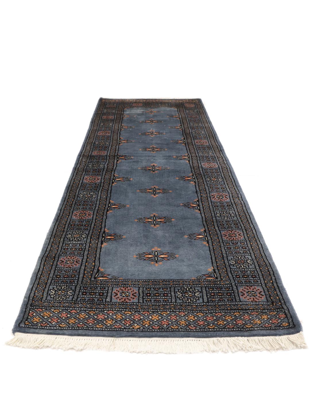 Loper kleed uit Pakistan in blauw