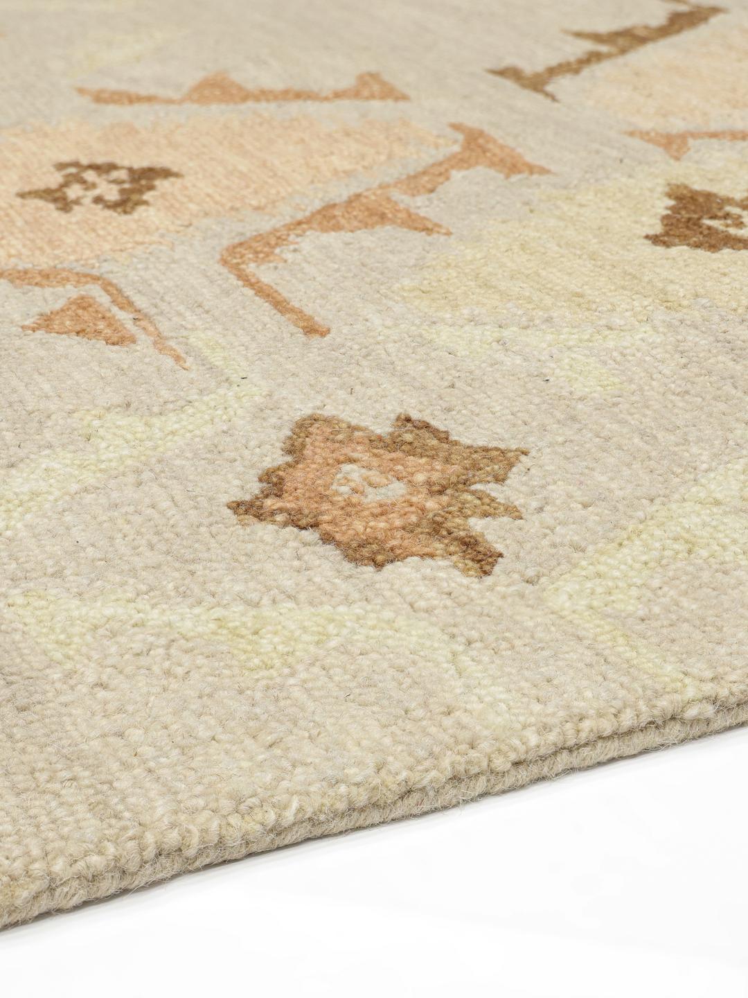 Multifarvet hand-tufted uldtæppe med geometriske pastelmønstre