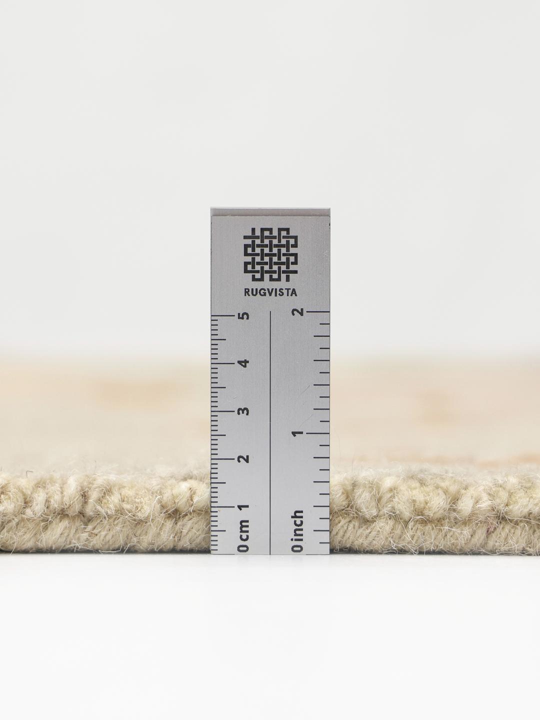 Multifarvet hand-tufted uldtæppe med geometriske pastelmønstre