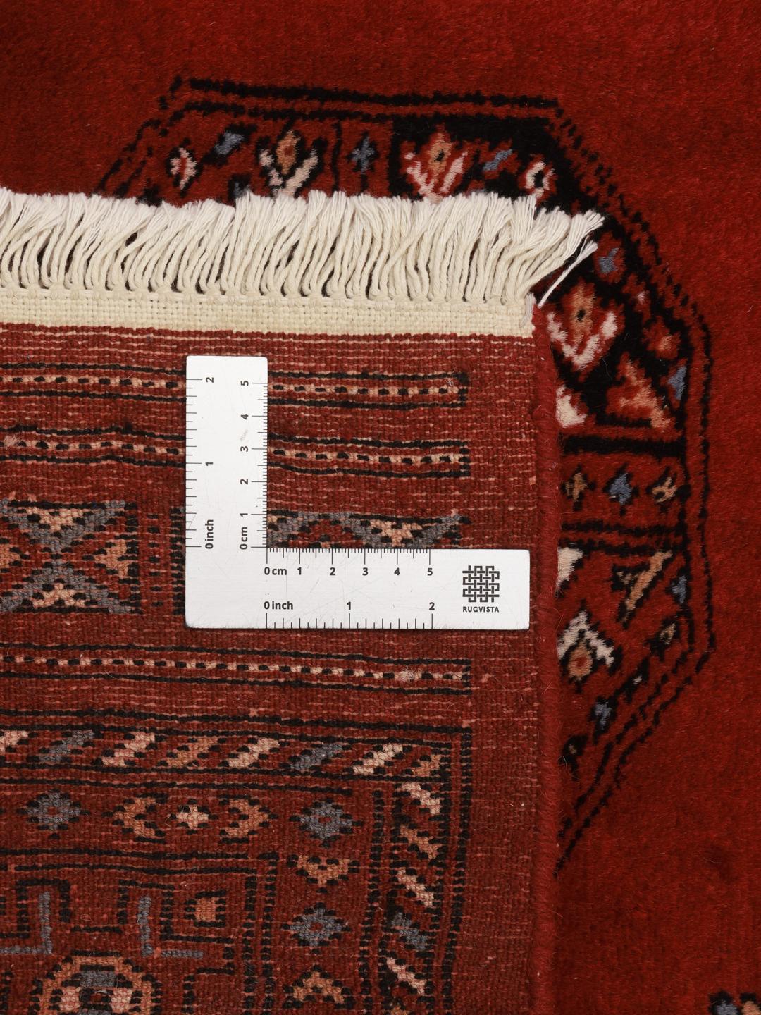 vloerkleed afkomstig uit Pakistan in rood