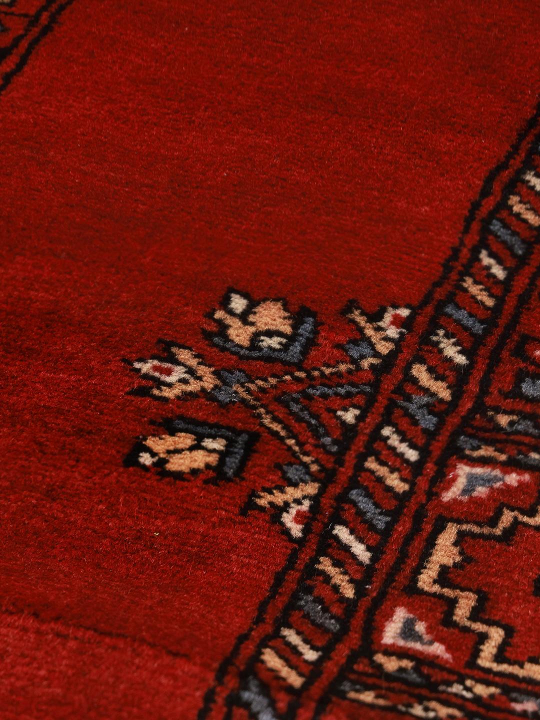Handmade wool rug from Pakistan in red