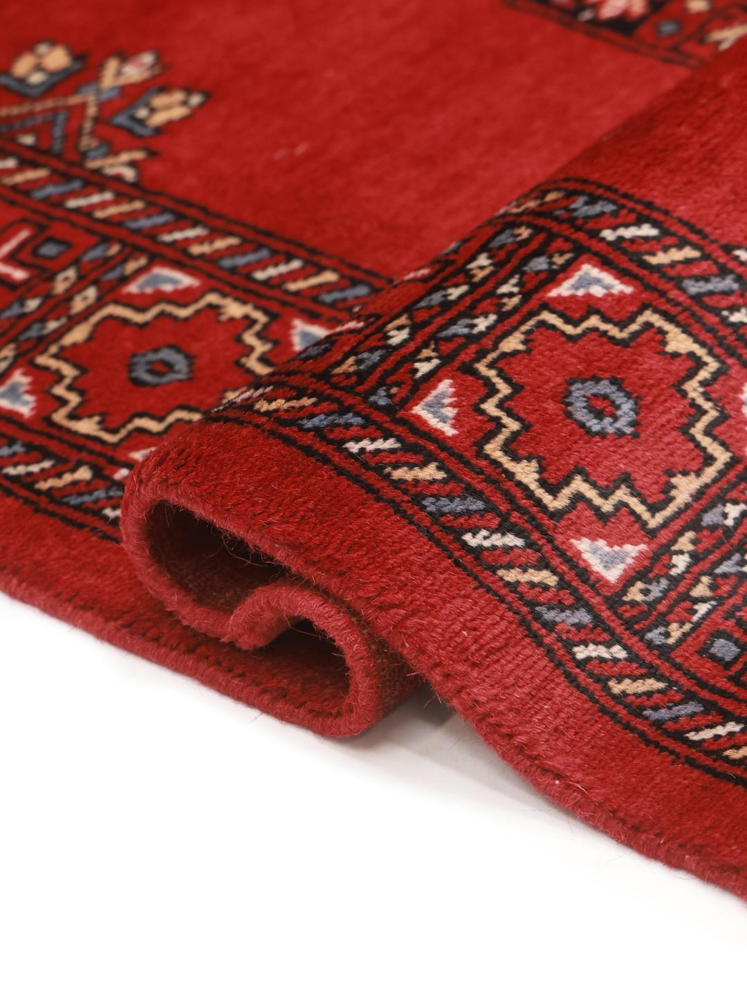 Handmade wool rug from Pakistan in red