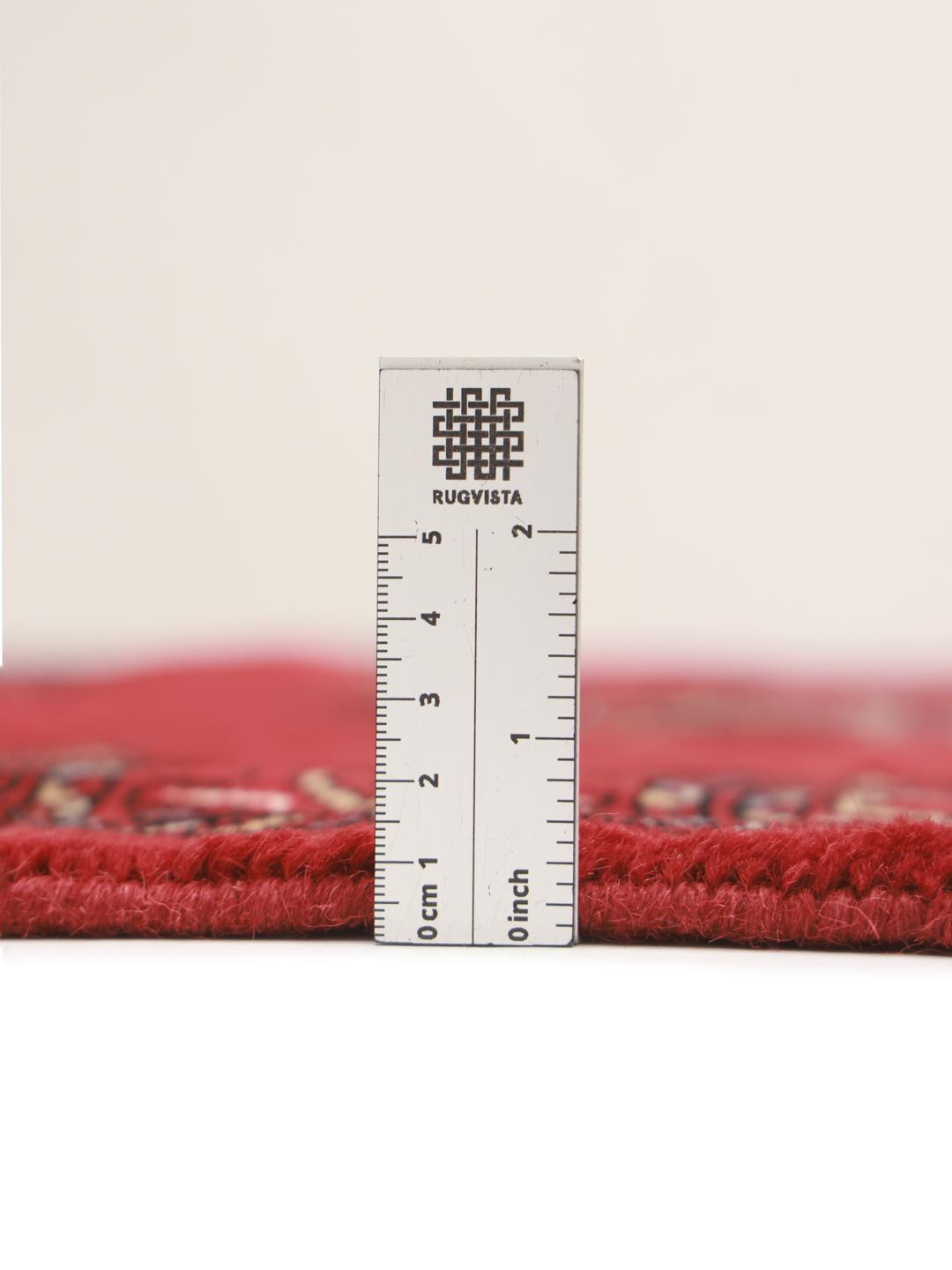 Handmade wool rug from Pakistan in red