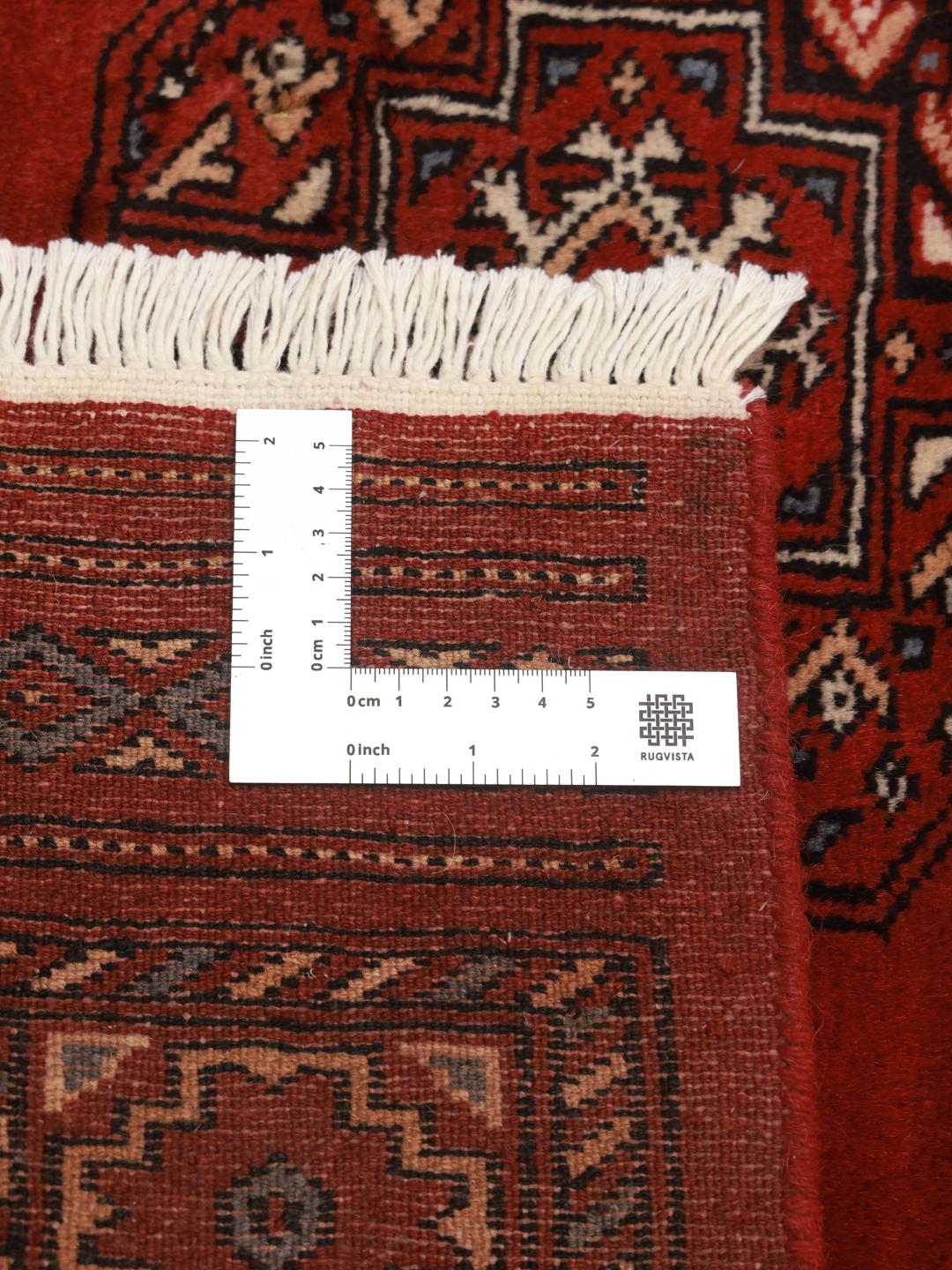 Handmade wool rug from Pakistan in red