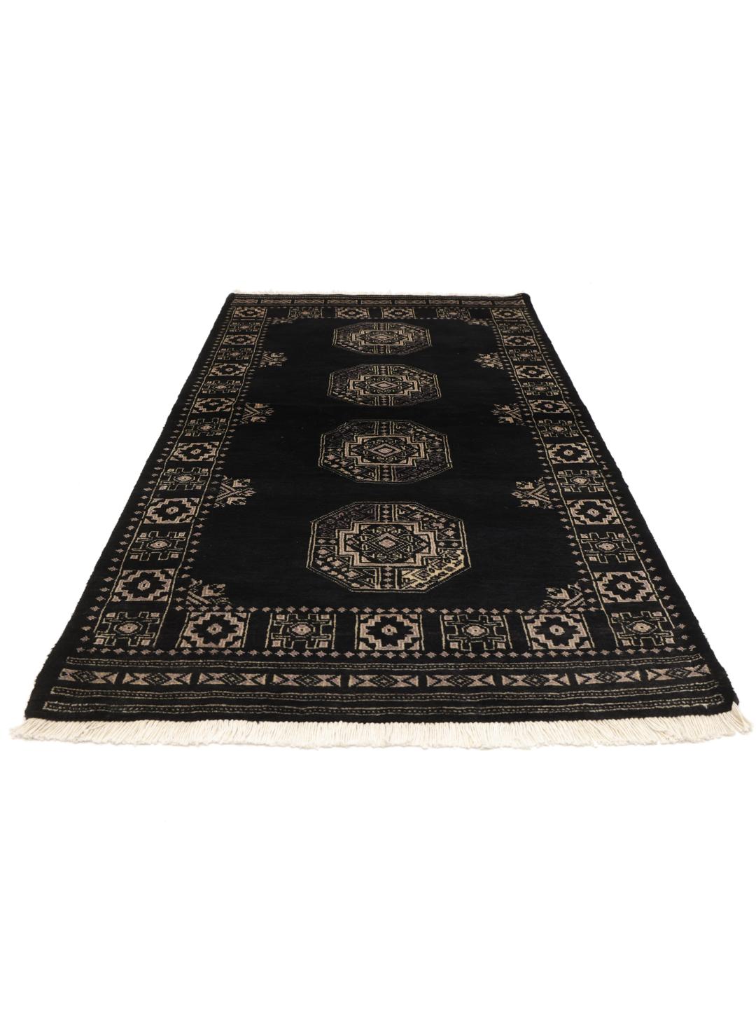 Hand-knotted Pakistani rug in black with traditional motifs