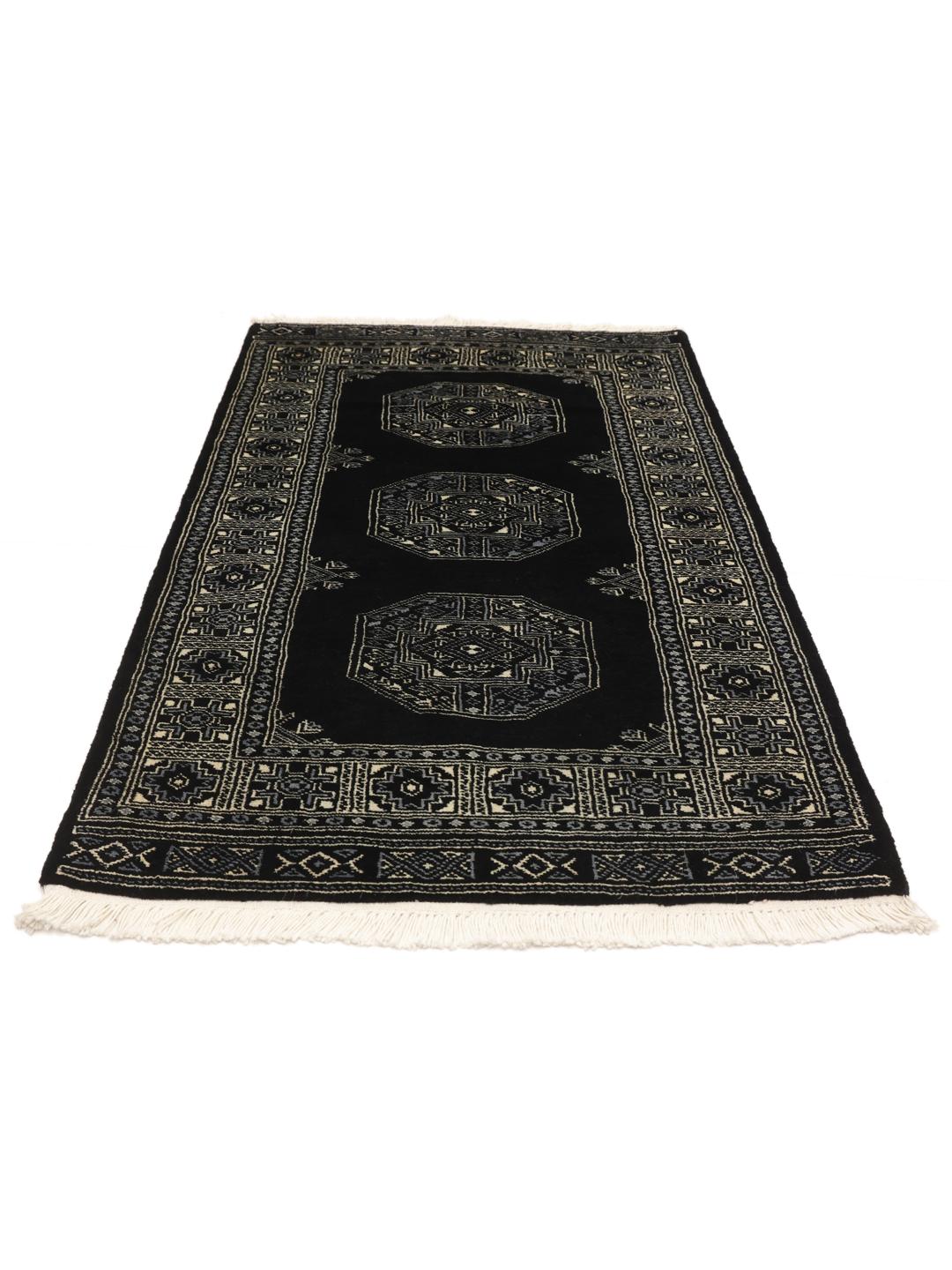 Handmade Bokhara rug from Pakistan in black with traditional motifs.