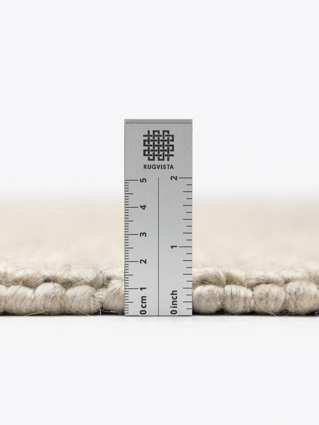 Beige wollen vloerkleed met gestructureerd oppervlak