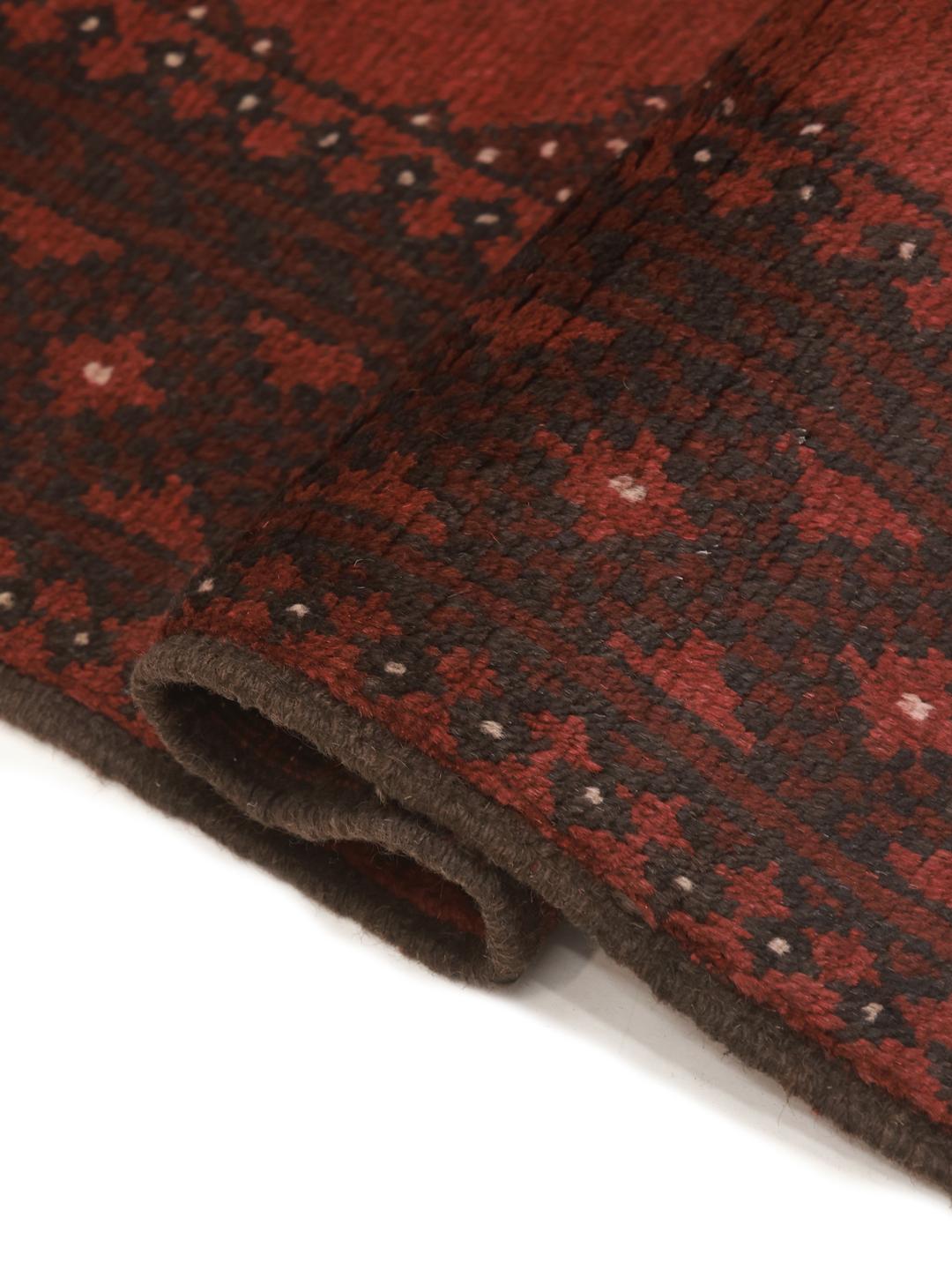 Tapis de couloir en laine rouge fonce noue a la main en Afghanistan
