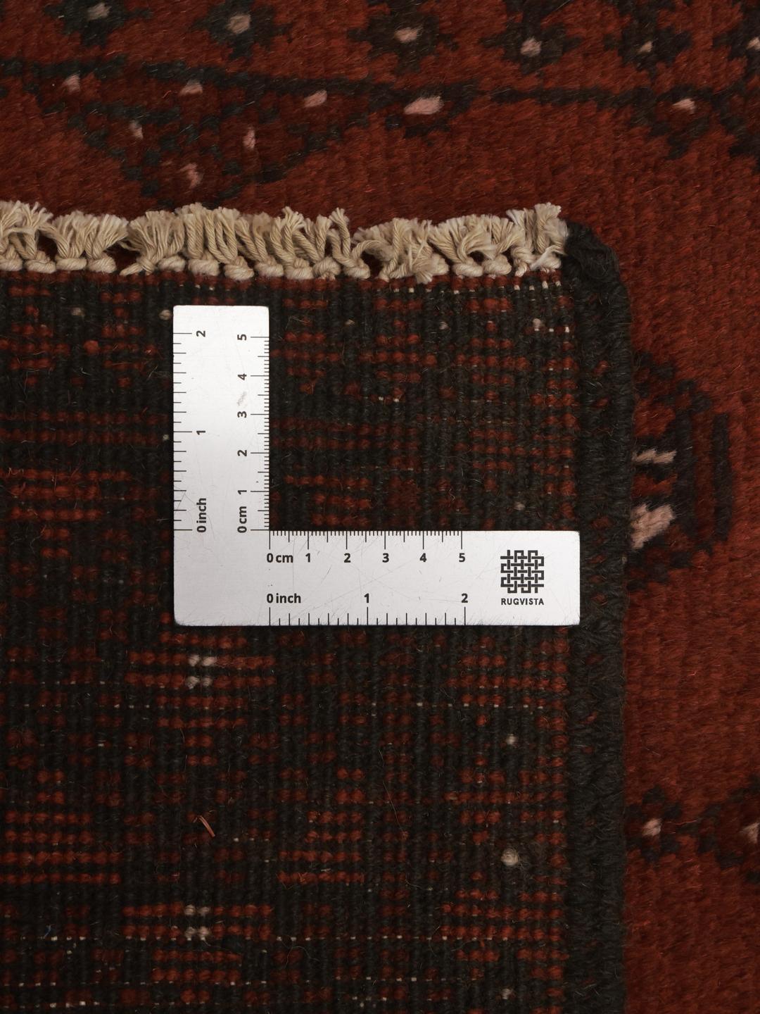Tapis de couloir en laine rouge fonce noue a la main en Afghanistan