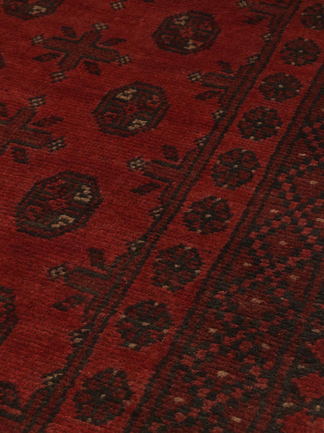 Hand-knotted Afghan Fine runner rug in dark red and black wool with geometric medallions