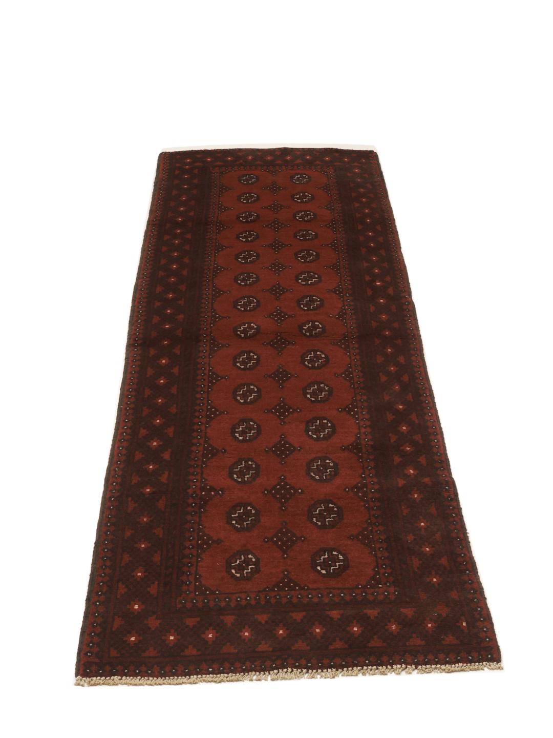 Tapis de couloir en laine rouge fonce noue a la main en Afghanistan