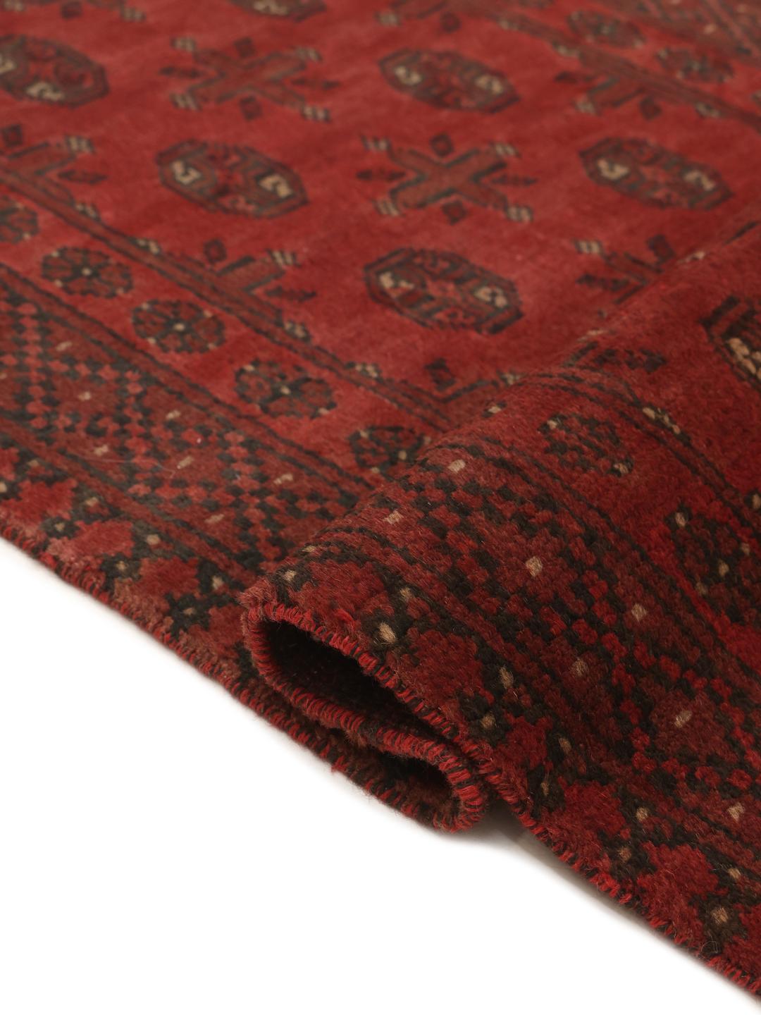 Hand-knotted Afghan Fine runner rug in dark red and black wool with geometric medallions