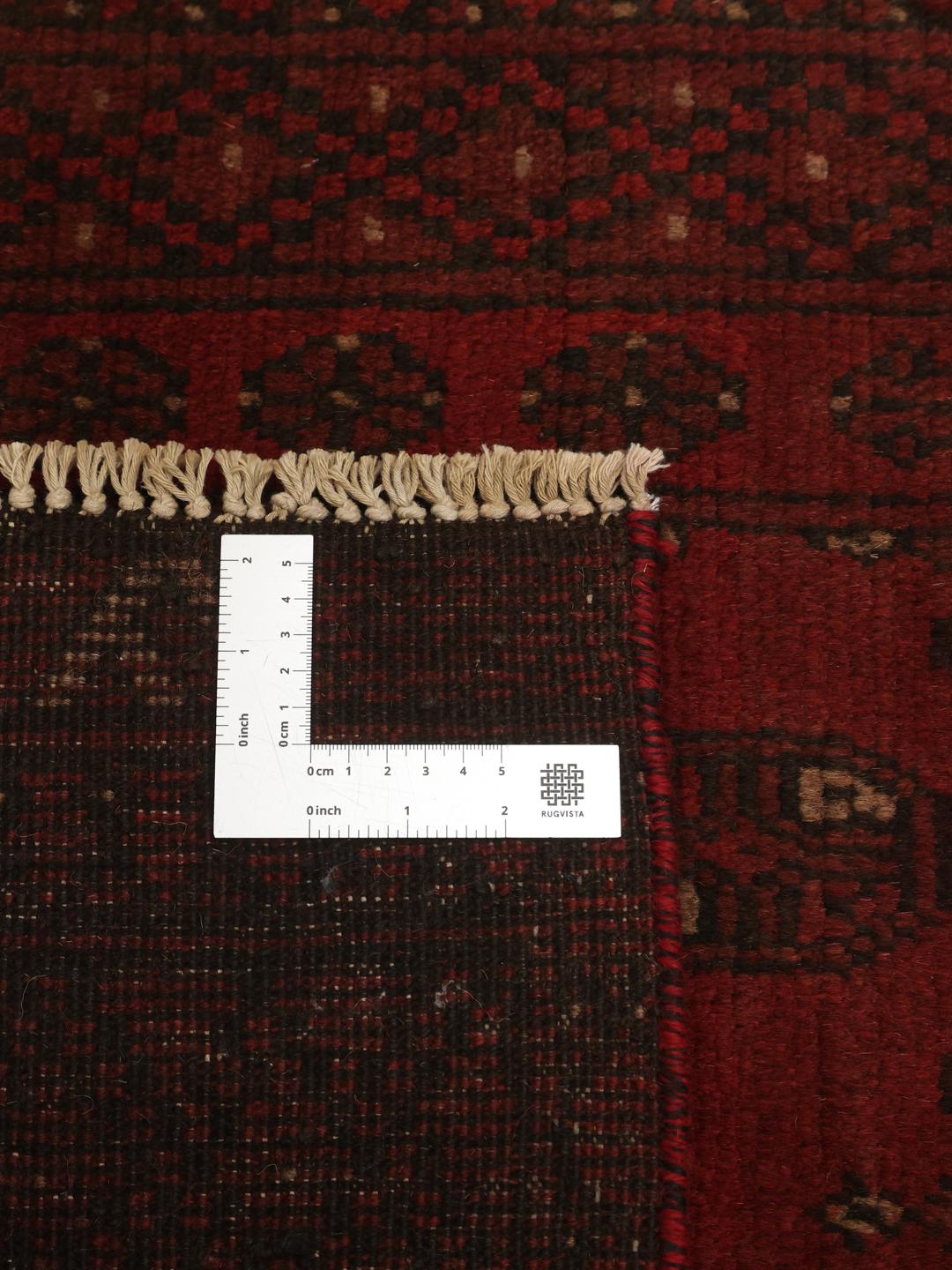 Hand-knotted Afghan Fine runner rug in dark red and black wool with geometric medallions