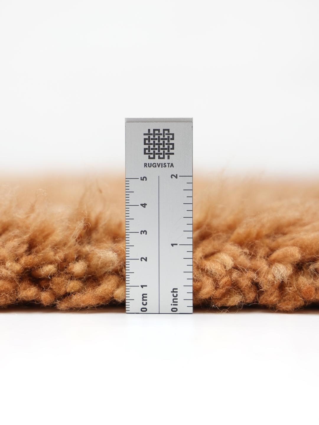 Roestorood handgeknoopt wollen vloerkleed met een hoog-laag patroon en franjes