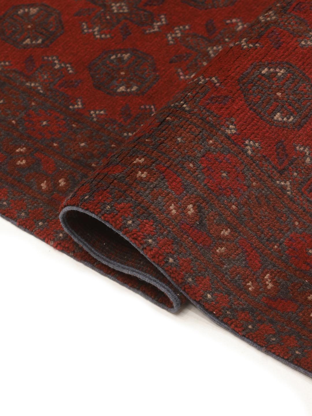 Hand-knotted Afghan runner in dark-red wool
