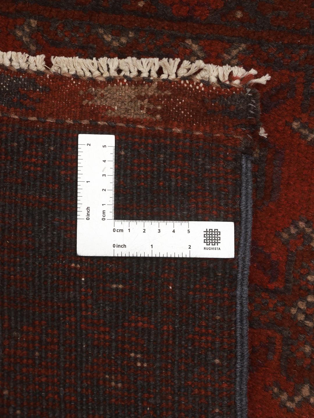 Hand-knotted Afghan runner in dark-red wool