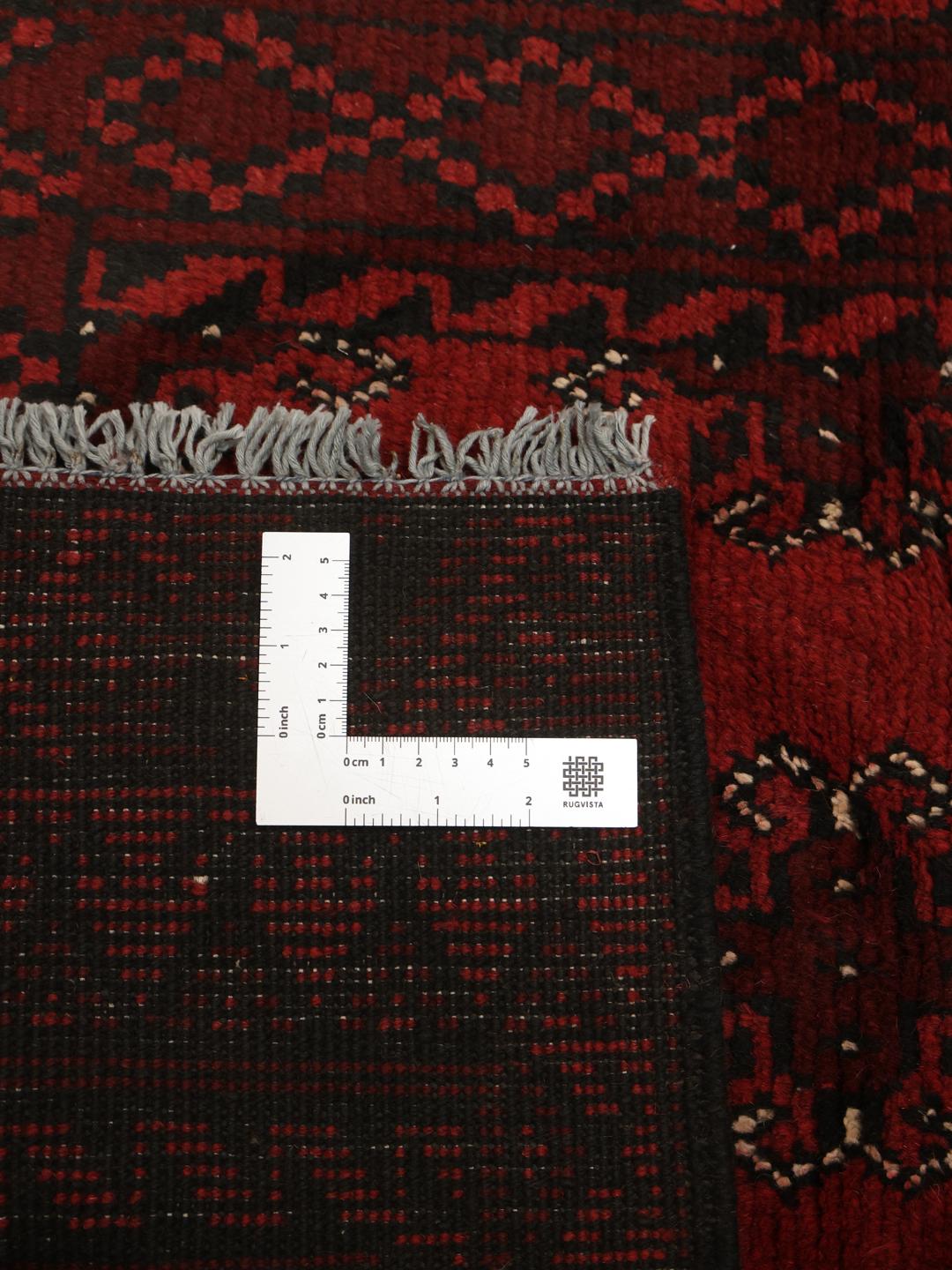 Tapis couloir noué à la main en provenance d'Afghanistan en rouge foncé et noir