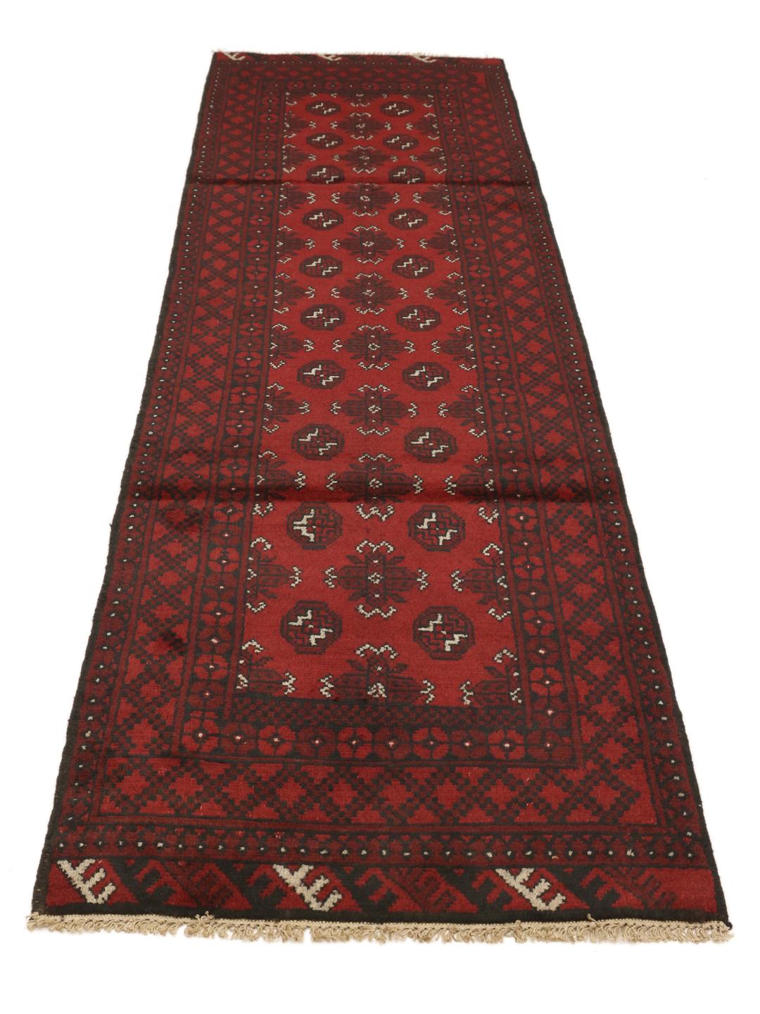 Hand-knotted runner rug from Afghanistan in dark red and black geometric patterns