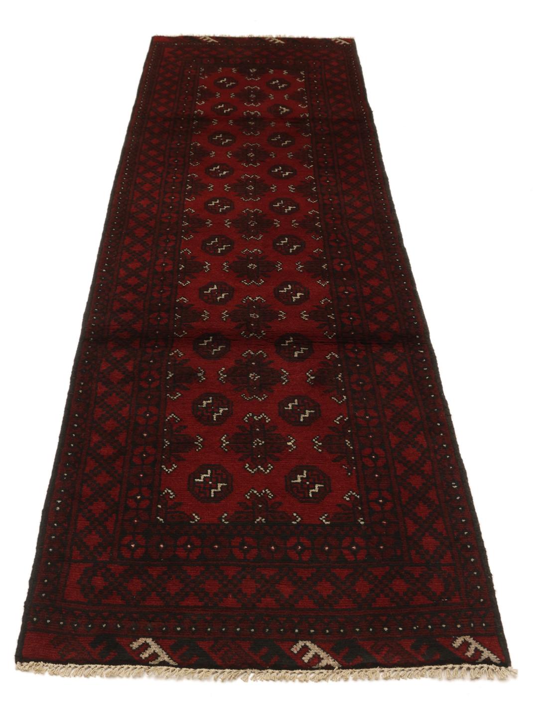 Hand-knotted runner rug from Afghanistan in dark red and black geometric patterns
