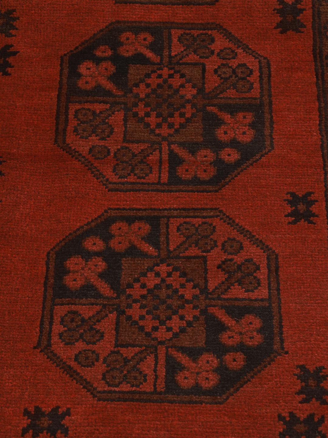 Hand-knotted dark-red rug from Afghanistan with traditional geometric medallions