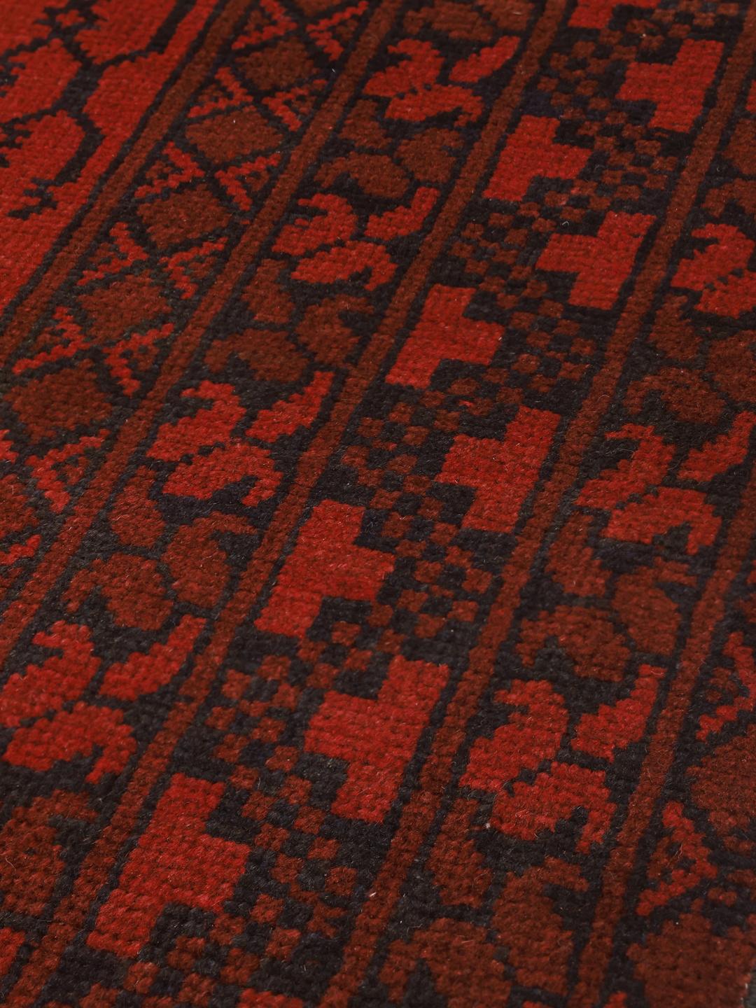Hand-knotted wool rug from Afghanistan in dark-red and black