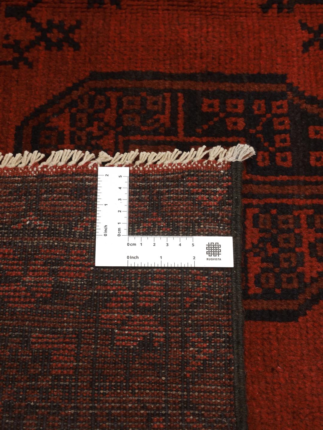 Hand-knotted wool rug from Afghanistan in dark-red and black