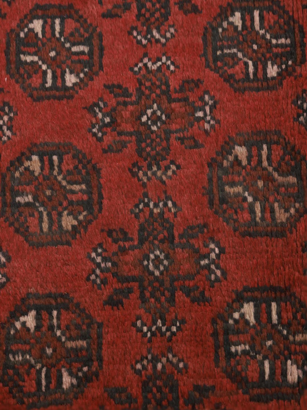 Hand-knotted dark-red wool rug from Afghanistan