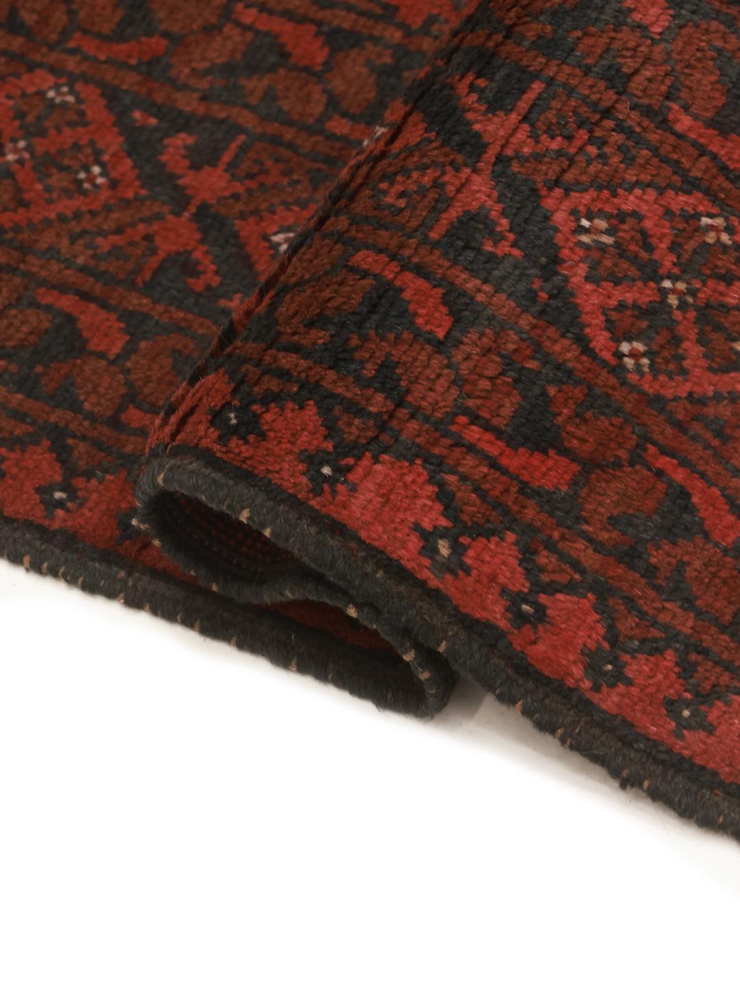Hand-knotted dark-red wool rug from Afghanistan