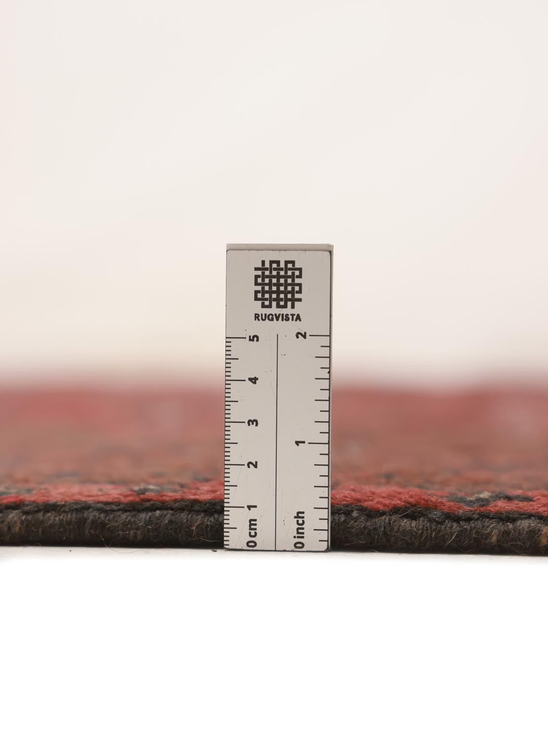 Hand-knotted dark-red wool rug from Afghanistan