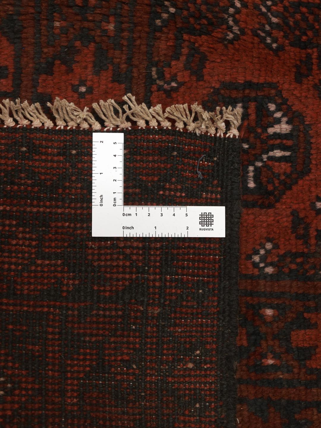 Hand-knotted dark-red wool rug from Afghanistan