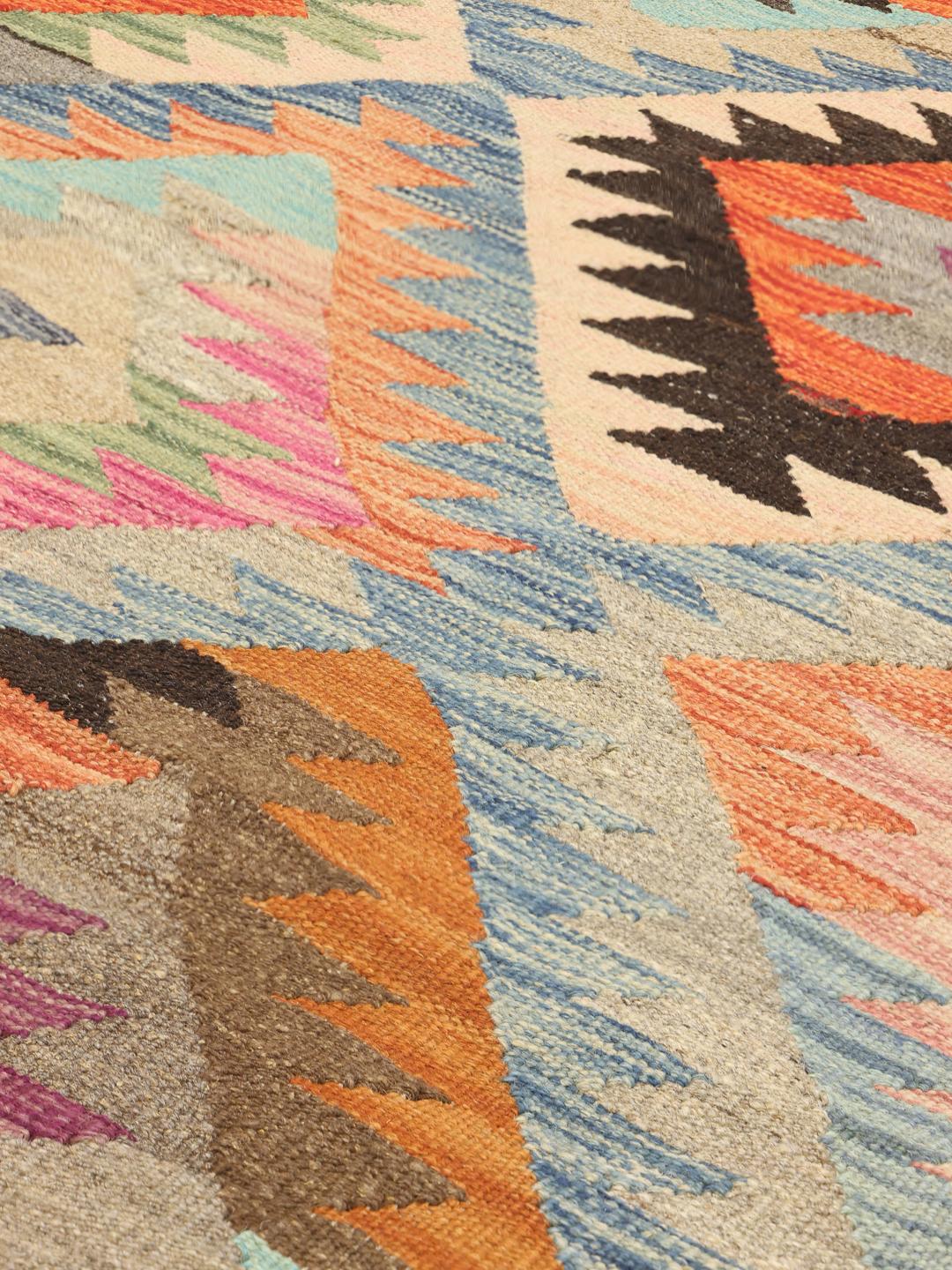 Handmade Afghan rug in multicolor with diamond patterns