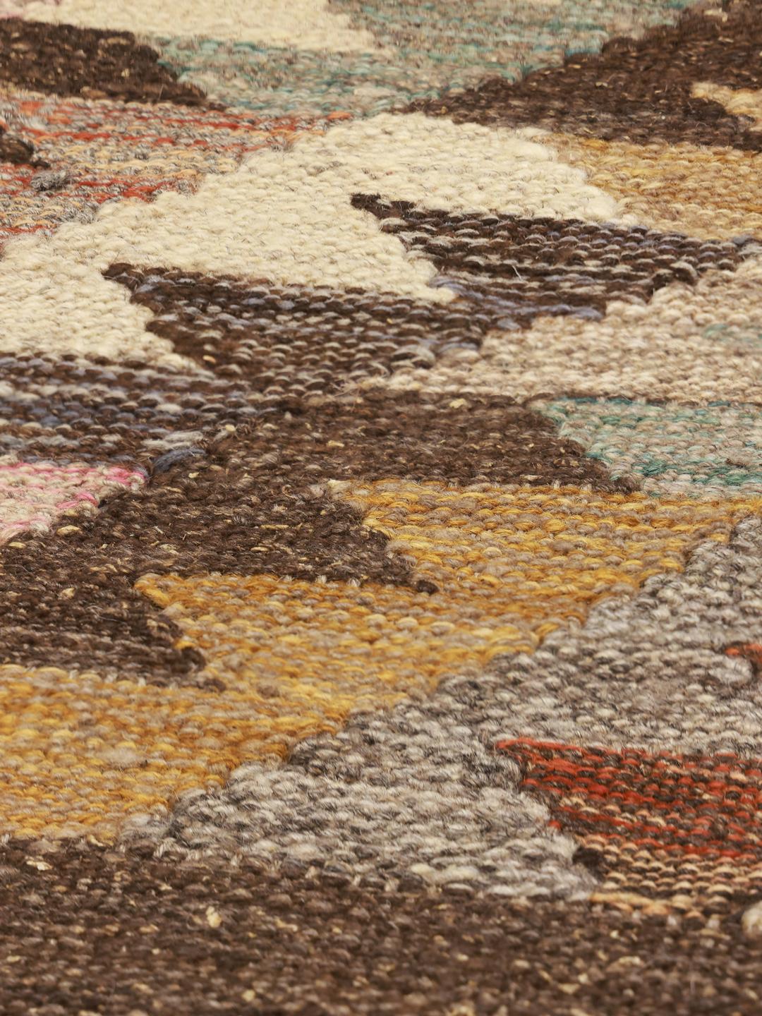 Handwoven wool Kilim Ariana rug in brown and multicolor