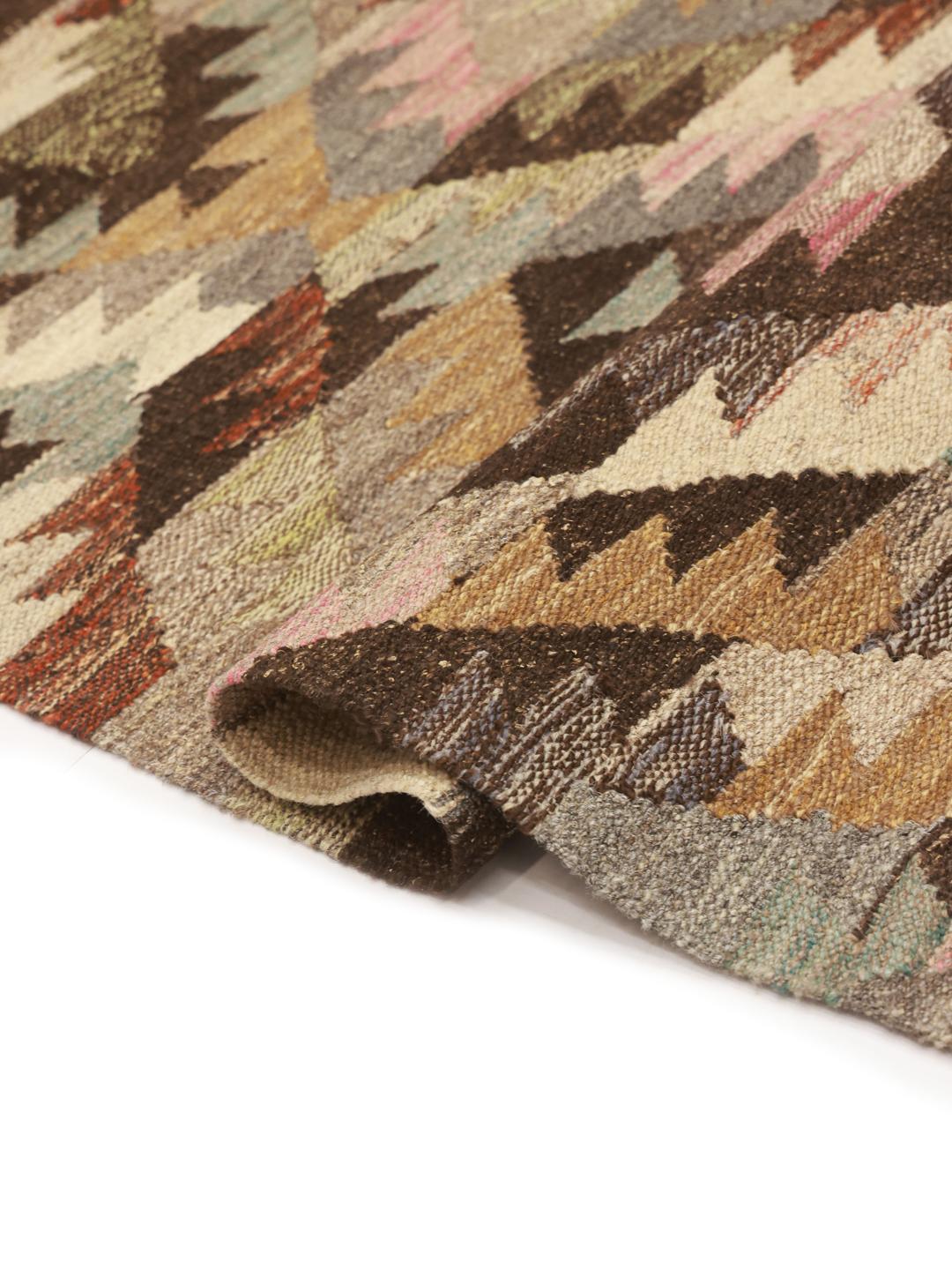 Handwoven wool Kilim Ariana rug in brown and multicolor