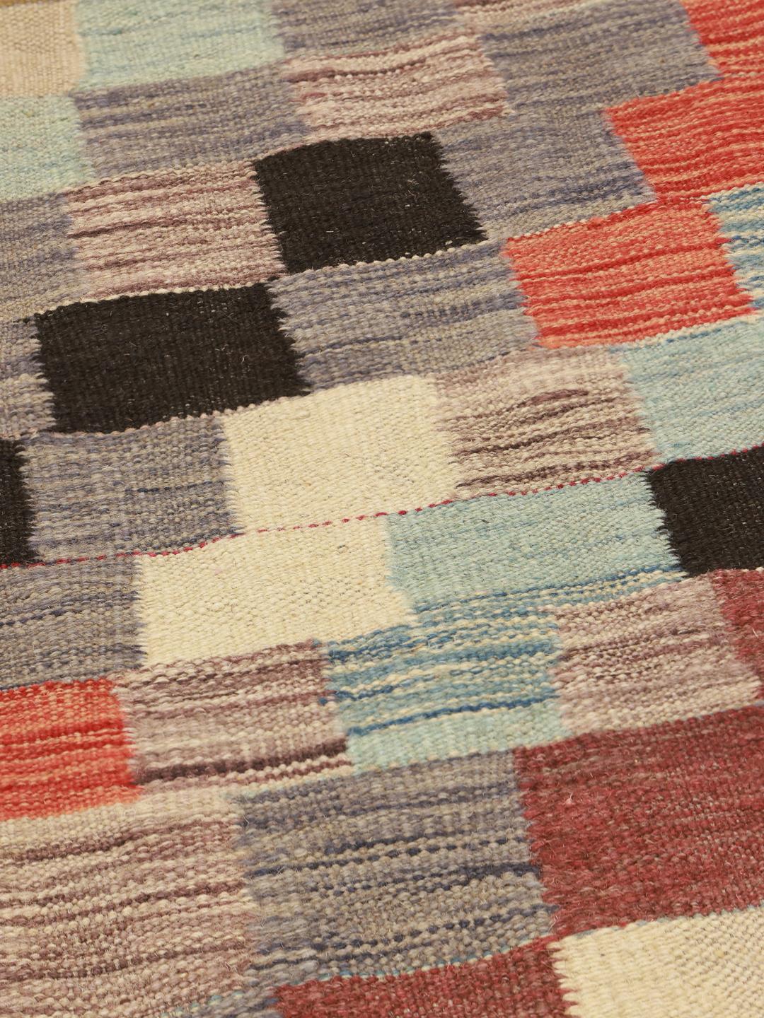 Handwoven multicolor wool rug from Afghanistan with a checkered pattern