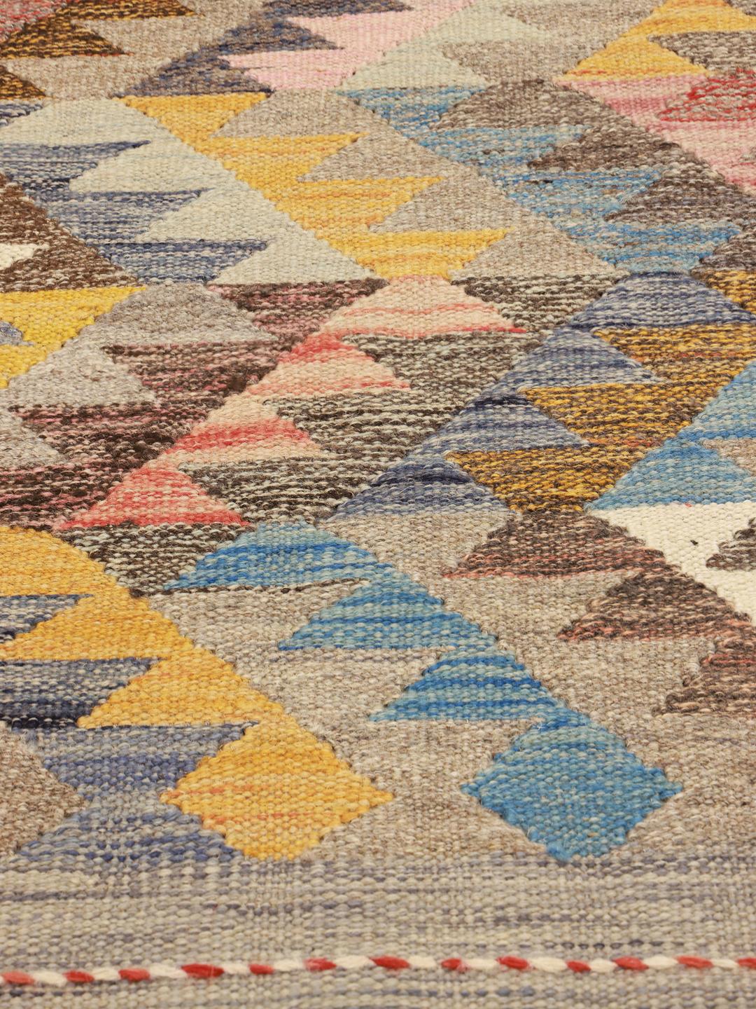 Handwoven Afghan wool rug in beige and multicolor with tribal diamond patterns